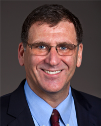 studio headshot of Dr. Cubells